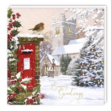 Card 3. A traditional Christmas watercolour painting capturing holly bushes, a lit up snowy Christmas Tree, footprints in the snowy path, and a red breasted robin is sat upon a red post box. The winter sky has a pink tinge and in the background is a traditional church building with font reading 'Seasons Greetings'.
