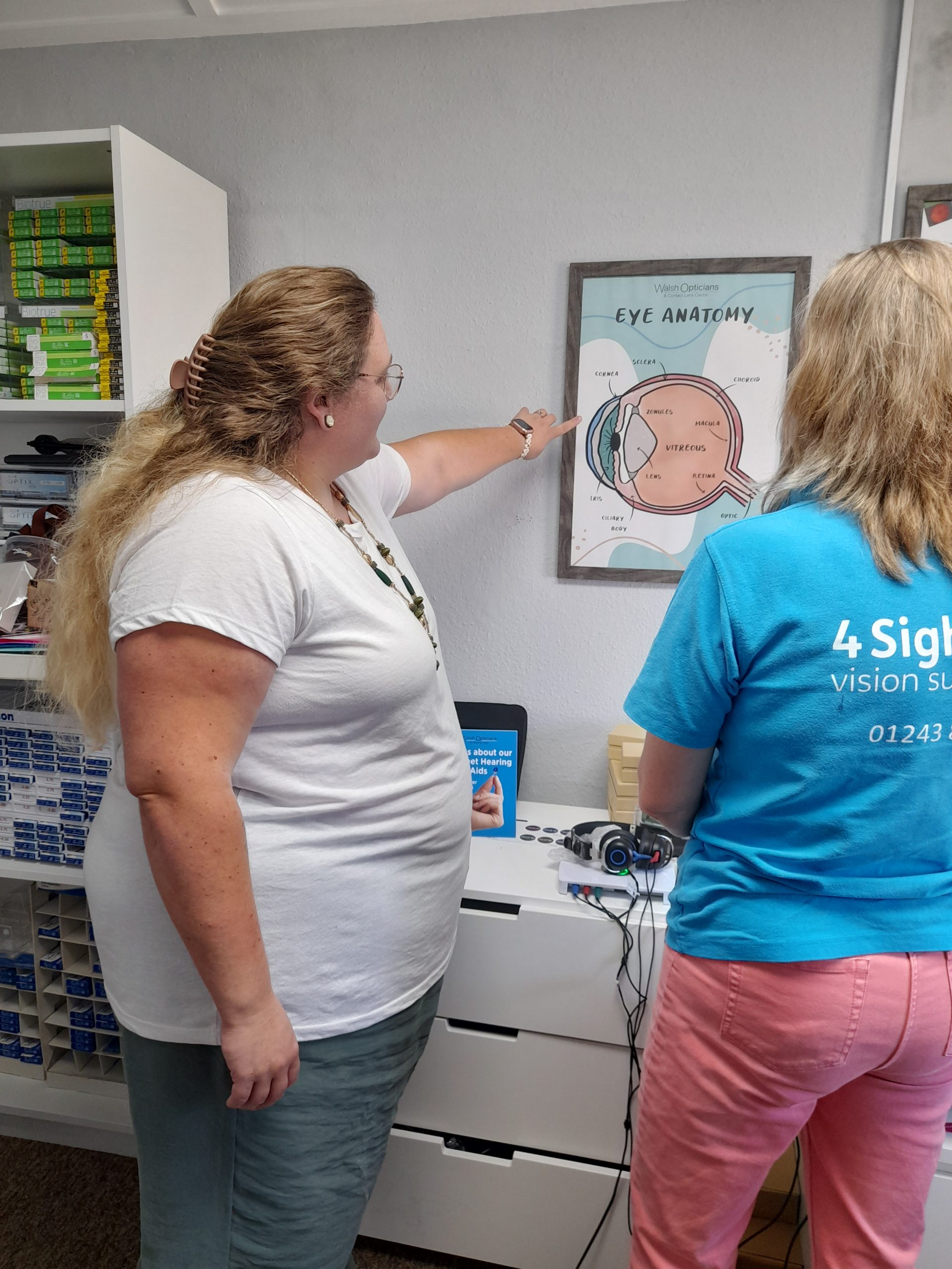 a member of the 4Sight Vision Support team discussing eye health with Emily from Walsh and Bridle opticians